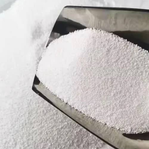 White palm wax flakes on a processing surface
