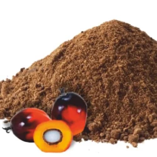 Mound of coarse brown palm kernel cake feed meal